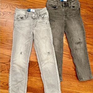 2 pair of distressed skinny jeans.